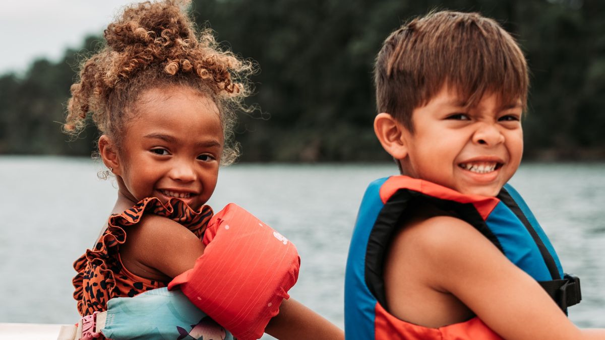 Children wearing water safety gear