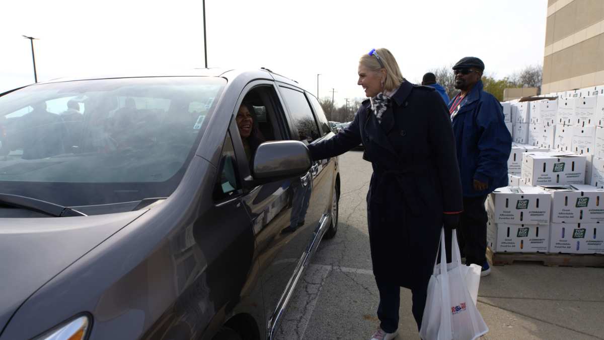 Amy Witherite of 1-800-TruckWreck, Witherite Law Group, and volunteers handed out hams and food boxes for Easter