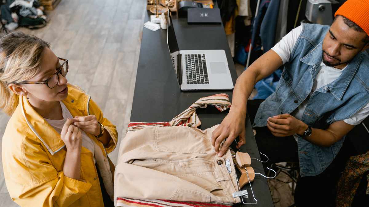 Black cashier serving a customer