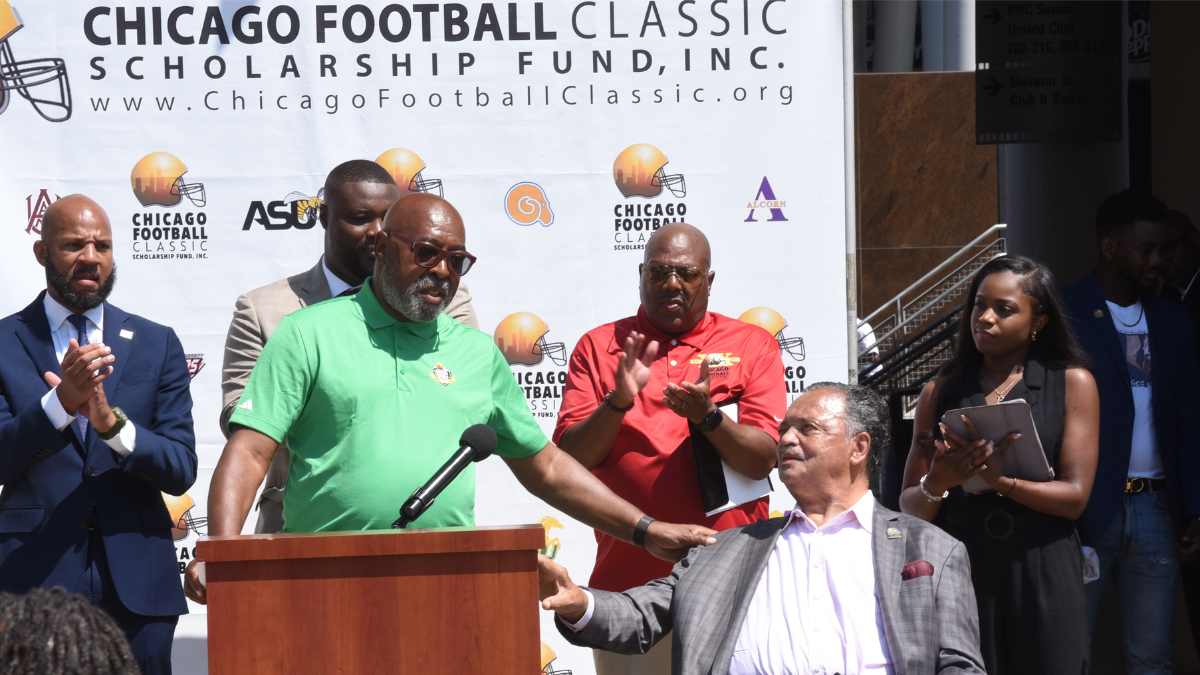 Chicago Football Classic Co-founder Larry Huggins with Rev. Jesse Jackson, flanked by Ald. Lamont Robinson (4th) (L), Co-founder Tim Rand and Brianna Moreland