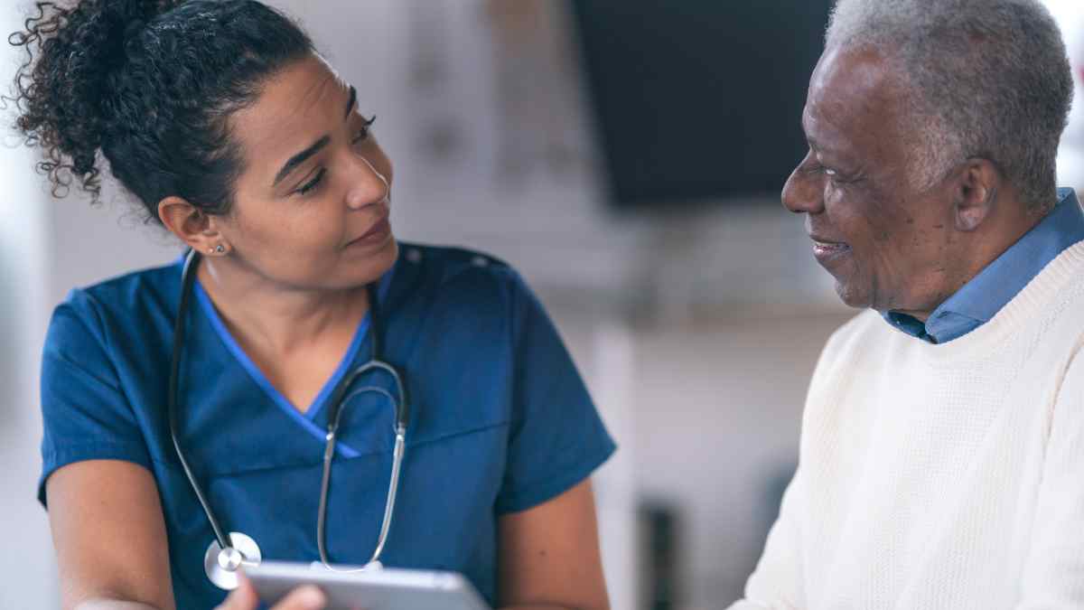 A doctor meets with a Black male patient, underscoring the importance of Black Men's Health.