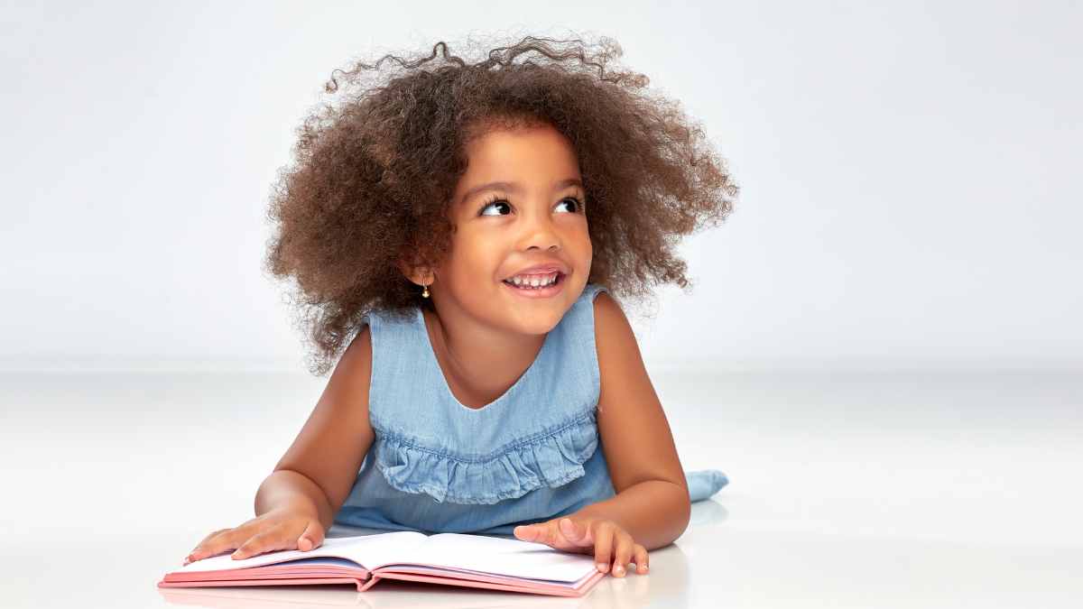 Young Child reading in advance of Words of Wonder Lit Fest