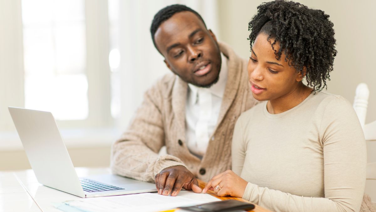Young couple planning finances together