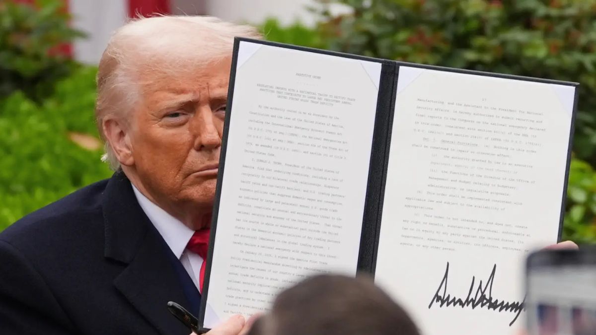 US President Donald Trump holds a signed executive order during an event to announce new tariffs, in the Rose Garden of the White House on Wednesday. (AP pic)